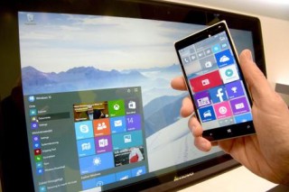 epa04662111 A person demonstrates the look-feel of new operating system Windows 10 for Smartphones and at the Microsoft stall at the CeBIT??technology fair in Hanover, Germany, 14 March 2015. The giant CeBIT computer trade fair takes place from 16 to 20 March 2015 with China as this year's partner country, underlining the Asian powerhouse economy's growing role in the IT business. IT security and high-speed wireless connections through new 5G-driven mobile devices have emerged as major themes at this year's CeBIT. EPA/PETER STEFFEN